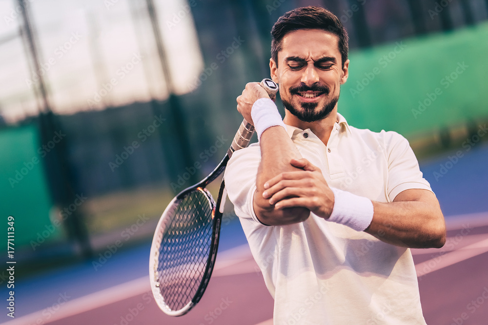 Man on tennis court